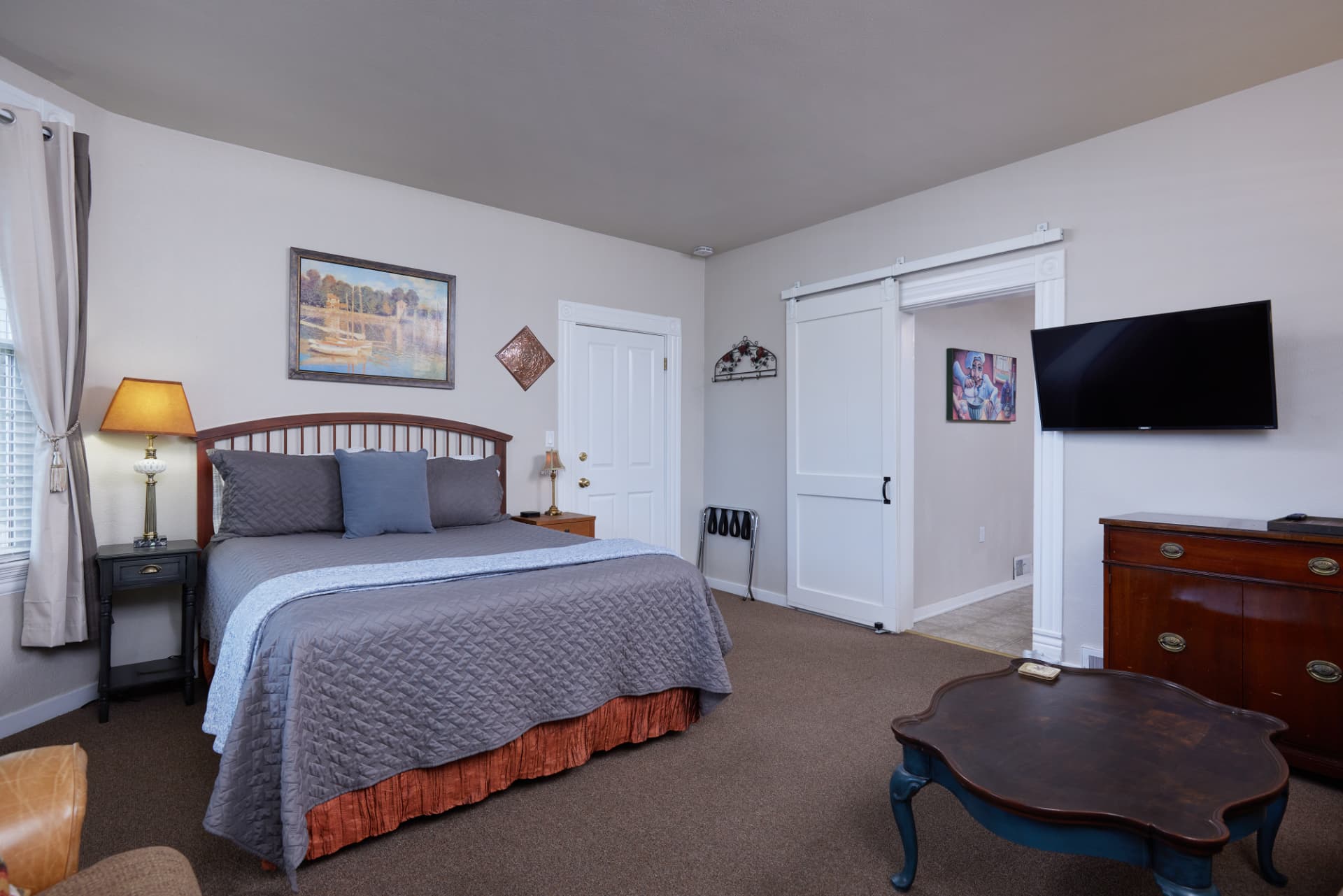 The Turret king bedroom with sliding barn door to the kitchen