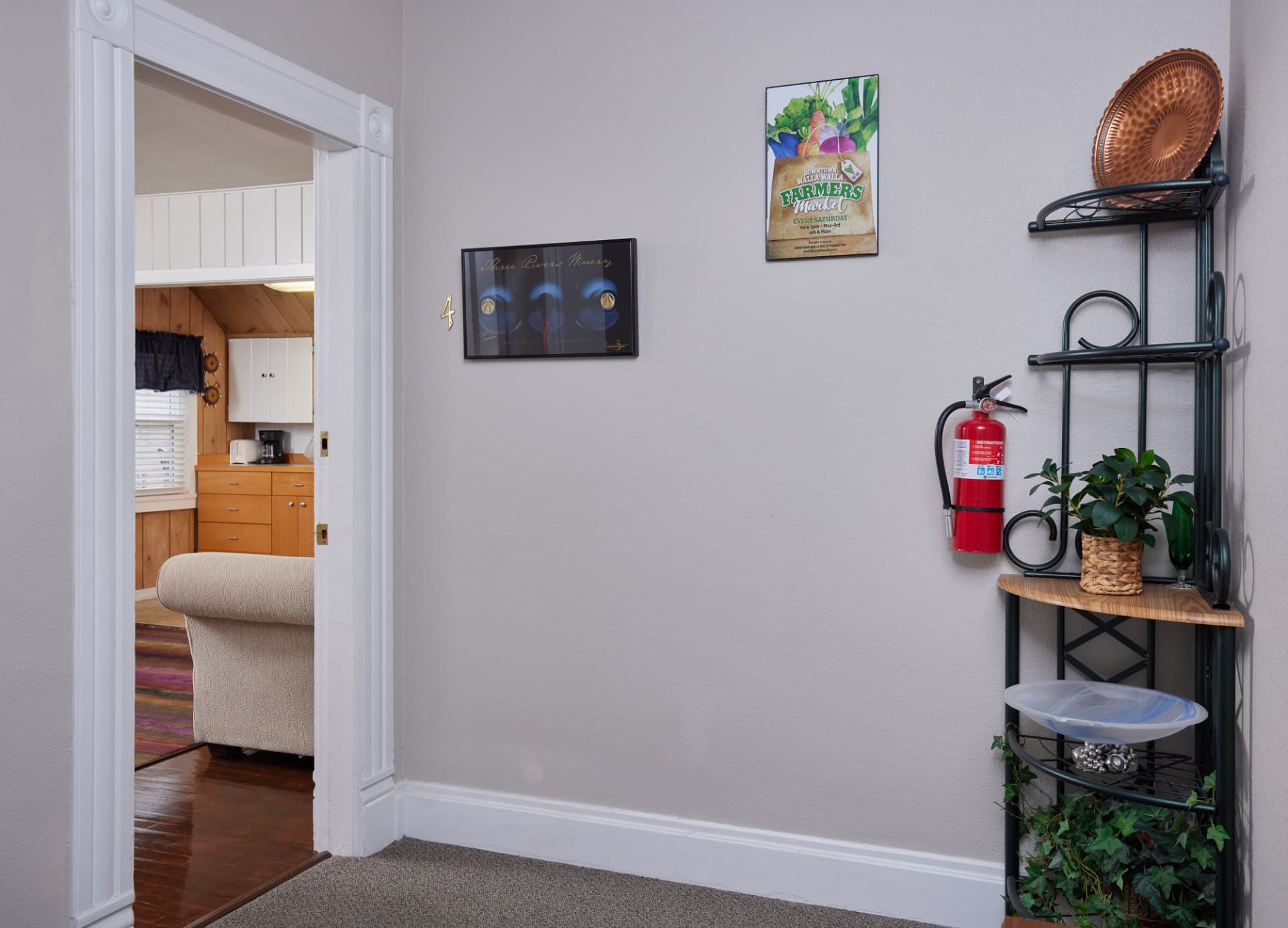 Entry into The Harbor apartment with a corner shelf