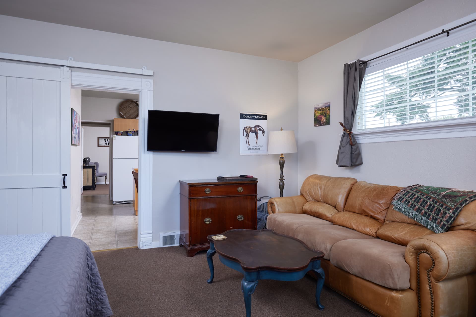 The Turret sitting area with sofa and dresser