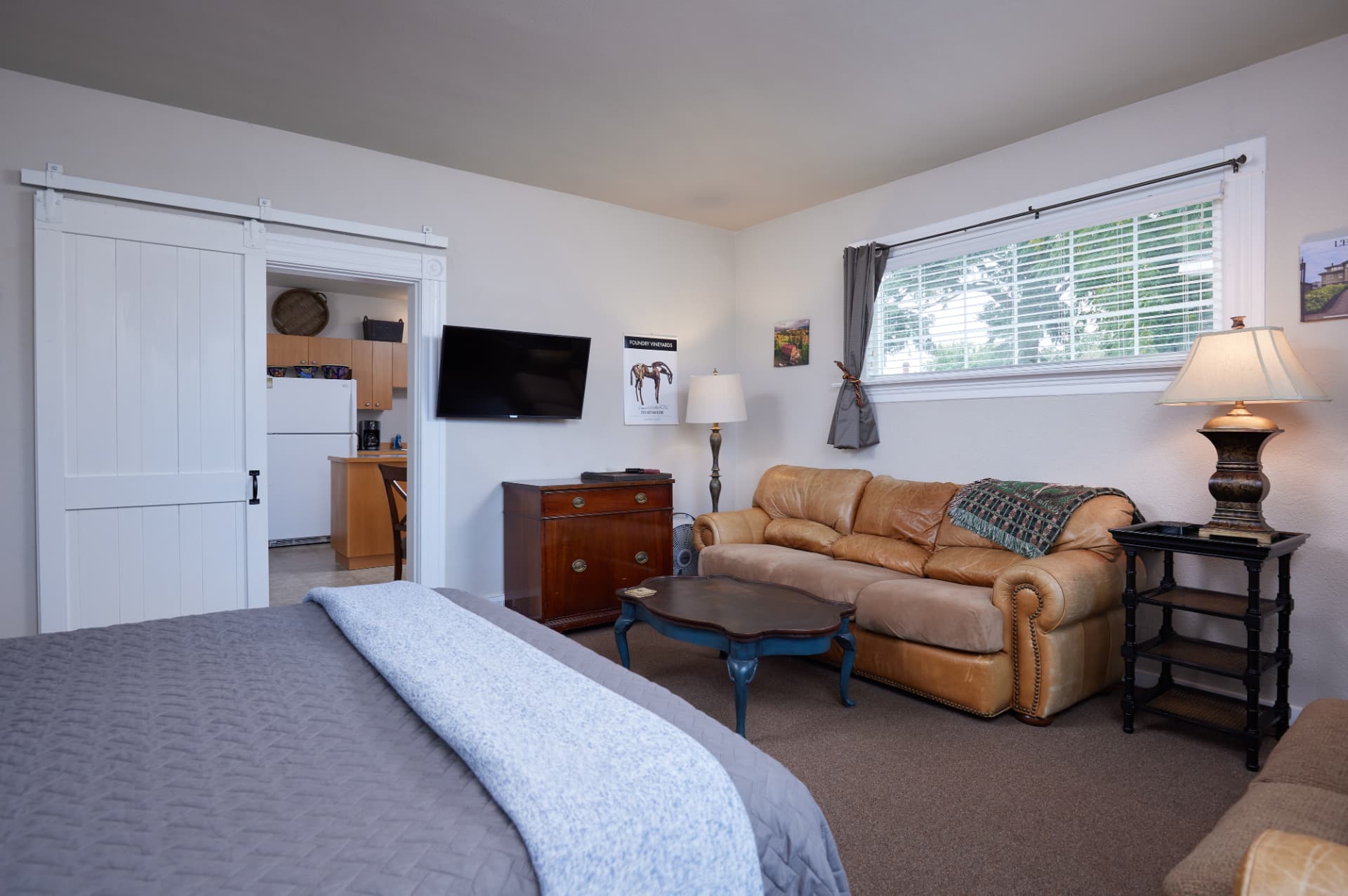 Sitting area beside the open barn door to The Turret kitchen